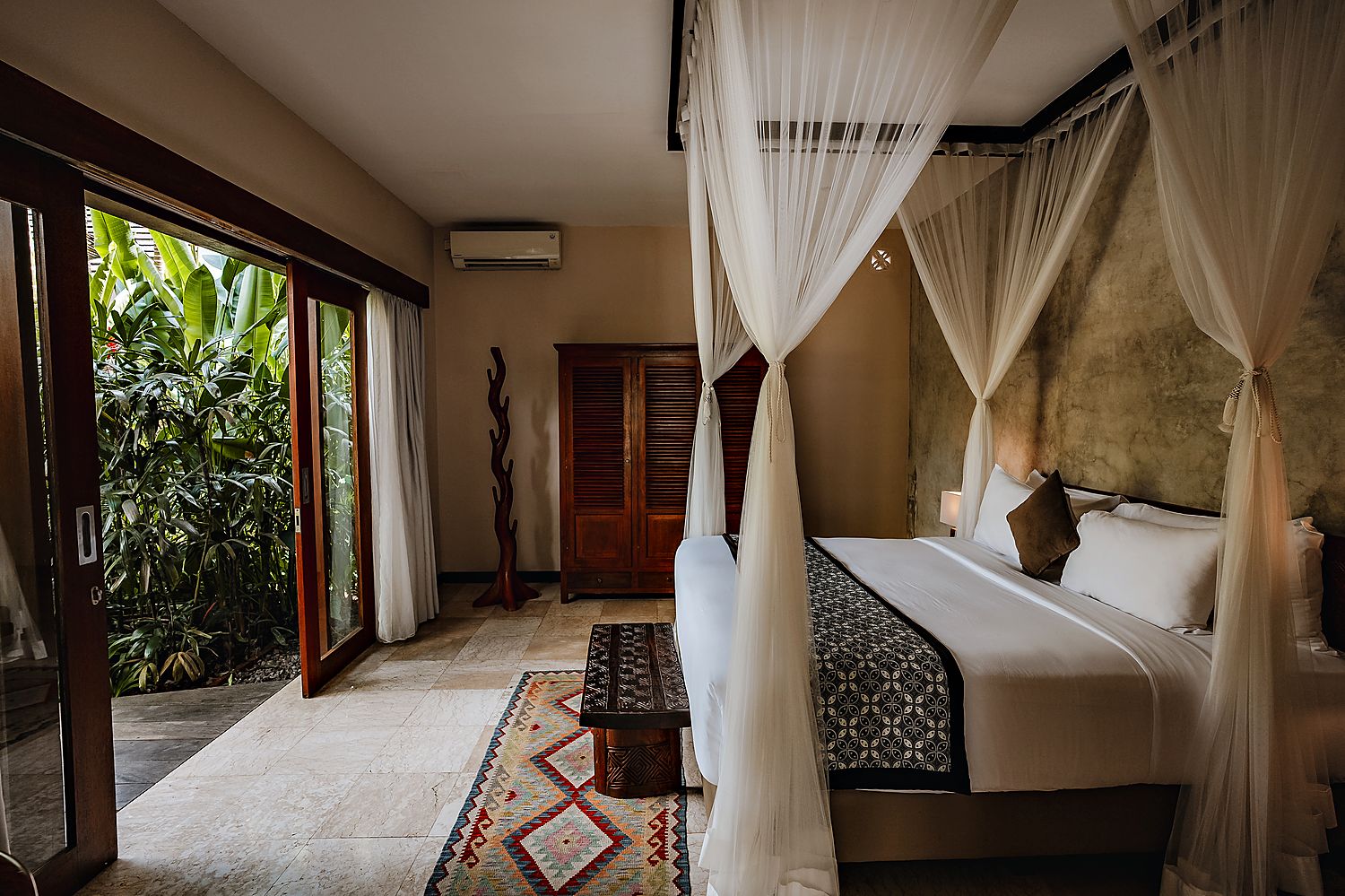 Canopy bed in the Honeymoon Pool Suite