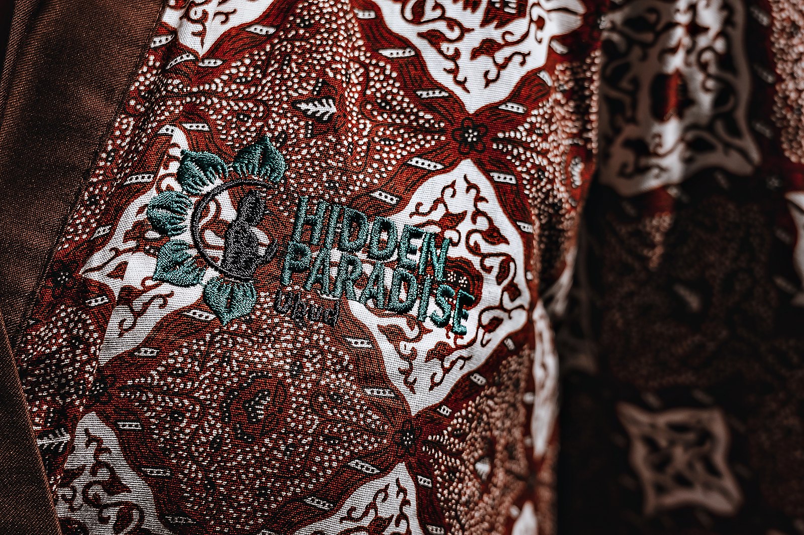 The batik robe, close up: brown and white pattern with the Hidden Paradise embroidery